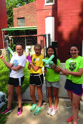 Sophomore+Abby+Yi+%28second+from+right%29+and+her+fellow+volunteers++repainted+the+children%E2%80%99s+center+%E2%80%98s+fading+and+chipping+exterior.++Along+with+painting%2C+the+volunteers+also+gardened+the+overgrown+plants.++%0D%0A