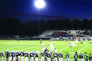 Football players line the field at the game against Blue Valley North at the Blue Valley High Stadium.