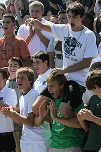 Juniors cheer their class to victory in the class competition at the first outdoor assembly.
