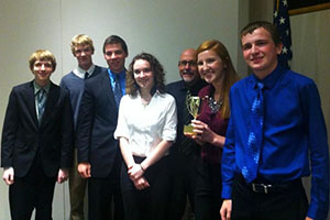 The History Club poses with its trophy after winning the Truman Library High School Trivia Contest last October.