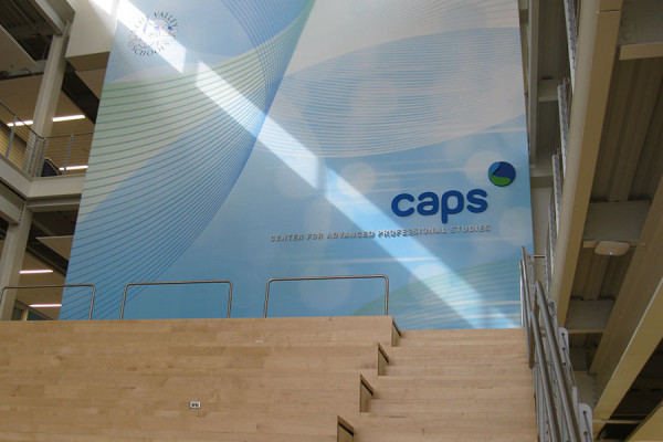 The main hall of the CAPS building showcases the CAPS logo.