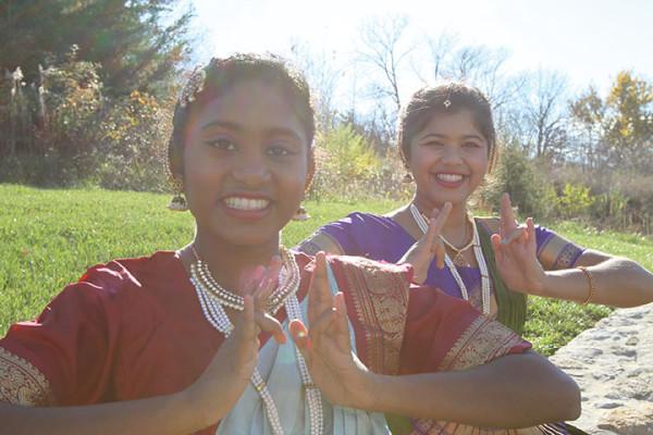 Sneha Bhavanasi and Rathi Narayn use their fingers to make the three pathaka, which is a commonly used hand configuration in bharatanatyam. Dancers can also use their fingers to represent a variety of symbols such as a flower, arrow, trident, woman, goddess, or lovebirds. Dancers combine finger movements with different positions of the body and face to tell stories.