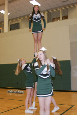 Cheer team leads the crowd in a half time chant.