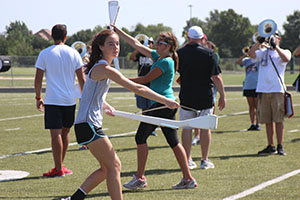 Freshman Meggie Fowler poses with her rifle and waits for direction.