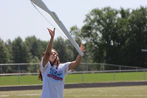 Senior Jaqueline Leonard focuses on her rifle as she tosses it into the air.