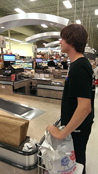 This high school student has decided to work at his local grocery store  