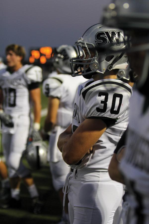 Sophomore Justin Hill waits to go back on the field with the other members of the defense during the game against rivals BV high tigers.  