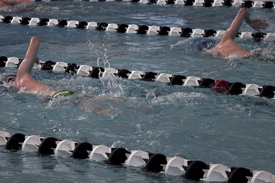 The swimmers warm up for state training.