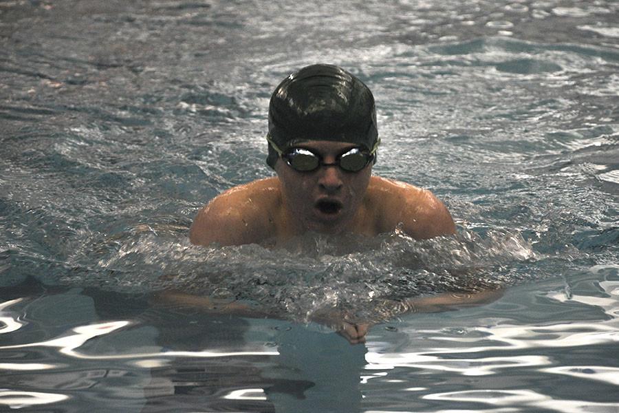 Freshman swimmer Trae Johnsen swims the 200 IM at EKL prelims on Feb. 6 in order to prepare for state.
