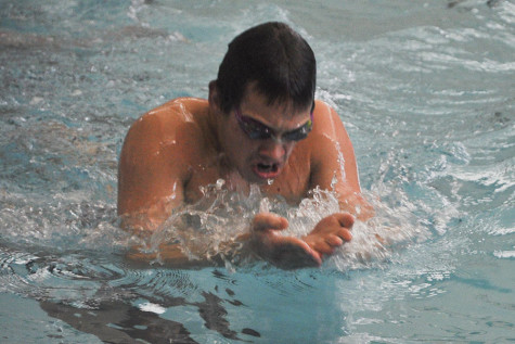 Senior swimmer Duncan Matchette practices his breastroke in preparation for the 200 IM that he will swim at state.