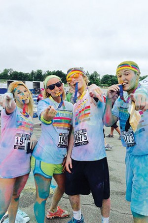 Juniors Addy Emerson, Olivia Swyers, Landon Smith and Matt Nixon celebrate at the finish line of the The Color Run. 