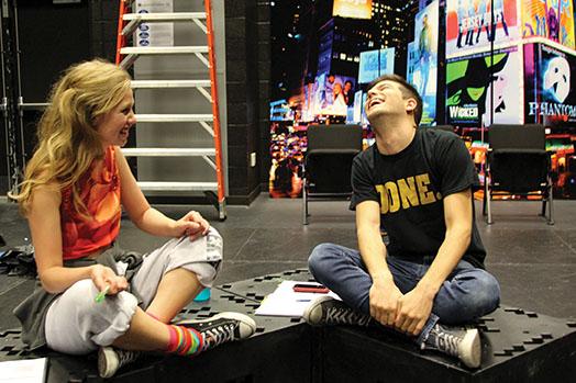 Sharing a laugh off stage, seniors Lauren Browning and Zach Miller rehearse for first date. Browning appears as Lauren and Miller can be seen playing Gabe. 