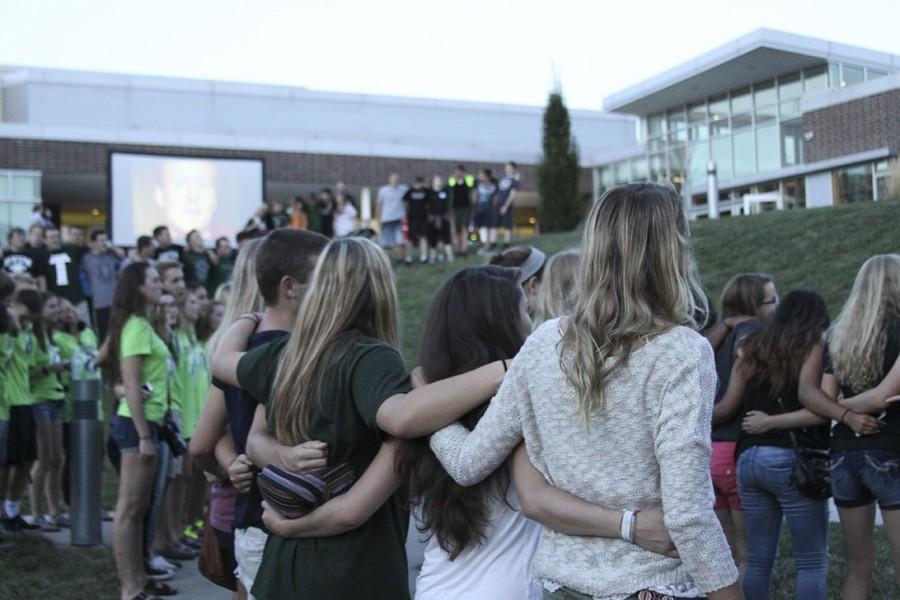 Bonfire attendees gather to sing the Southwest Alma Mater.