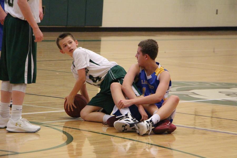 After going after the loose ball, player Justin Wingerter looks to the referee with anticipation of the upcoming call. 