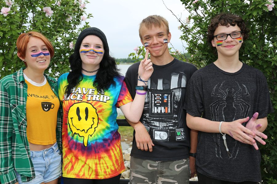 Sophomores Marie Oddo, Shannen Fahrnow, Brandon Lefert, and eighth grader Liam Olinger show their pride with facepaint depicting pride flags.