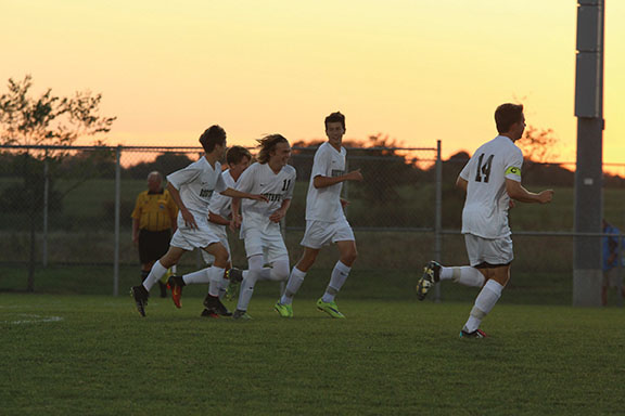 The team celebrates following junior Matthew Weaver’s goal.