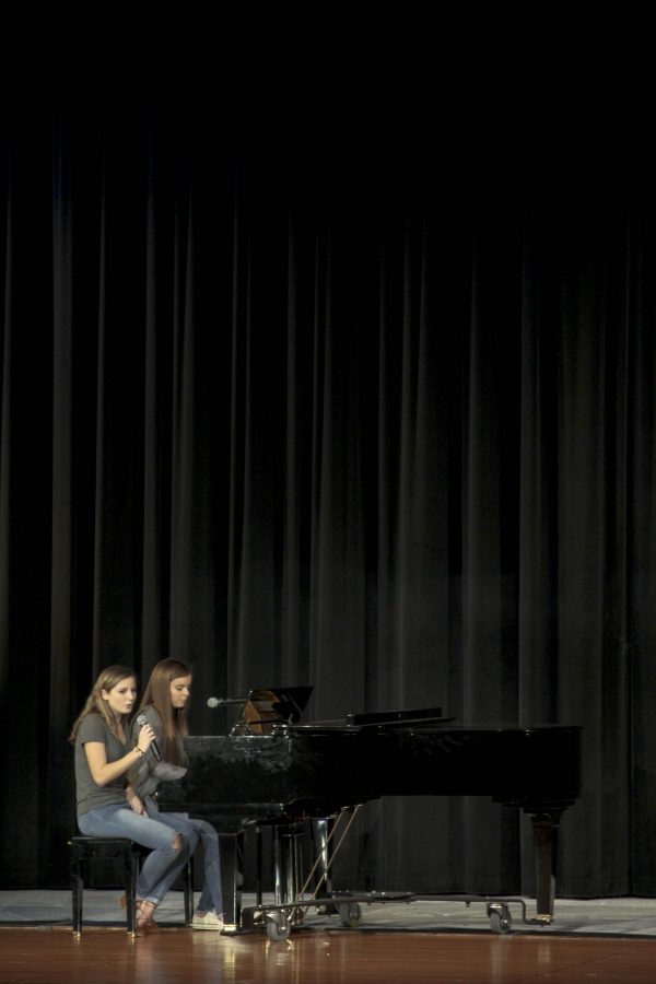 Amanda Wambold sings aside Quinlyn LaFon who plays piano along side her.