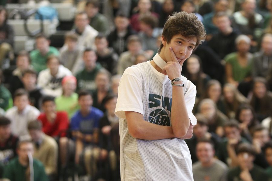 Senior Grant Peterson strikes a pose at the end of the senior dance during the class competition. 