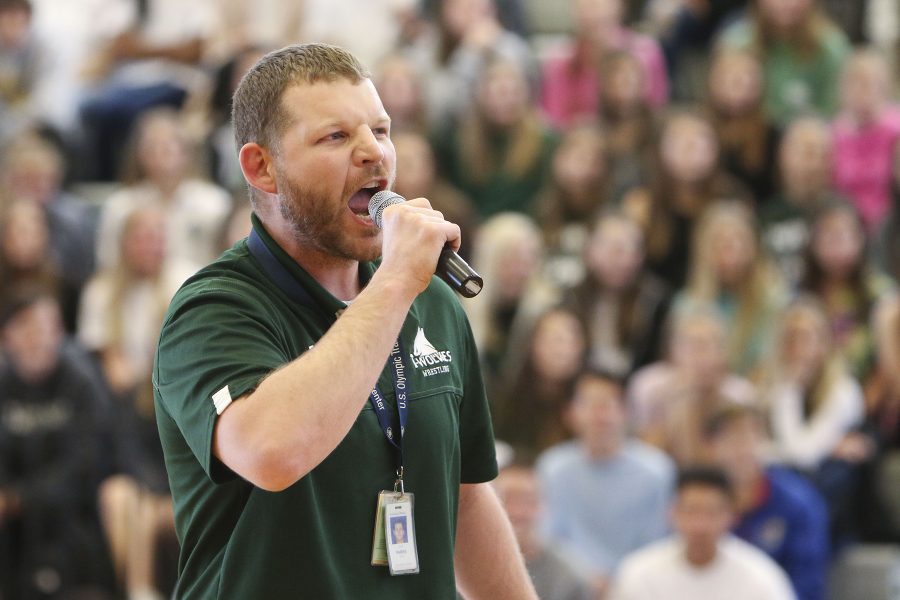 Industrial technology teacher Cody Parks announces the wrestlers that will be competing in the state competition. 