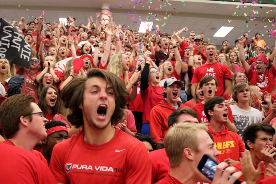 Senior Aidan Bates yells as the seniors do their chant.