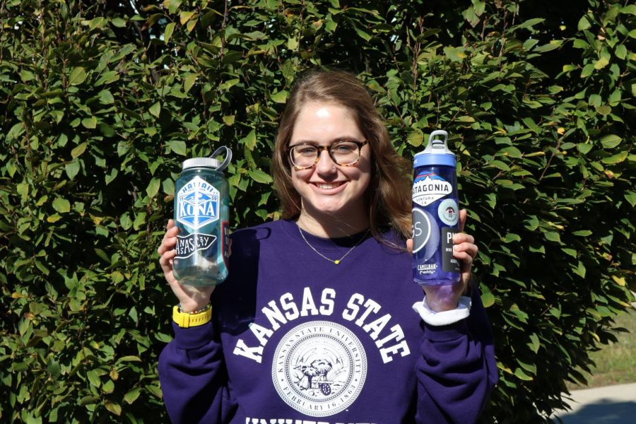 Savannah Greathouse flashes her two favorite water bottles. These stickers represent her favorite things, ranging from the outdoors to her favorite brands. 