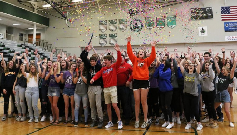 Hands in the air, the Southwest seniors shoot confetti cannons off at their senior picnic.