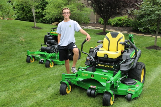 Trevor Schwartz poses with his tractors for a photoshoot in Mills Farm. 
Photo courtesy of Trevor Schwartz