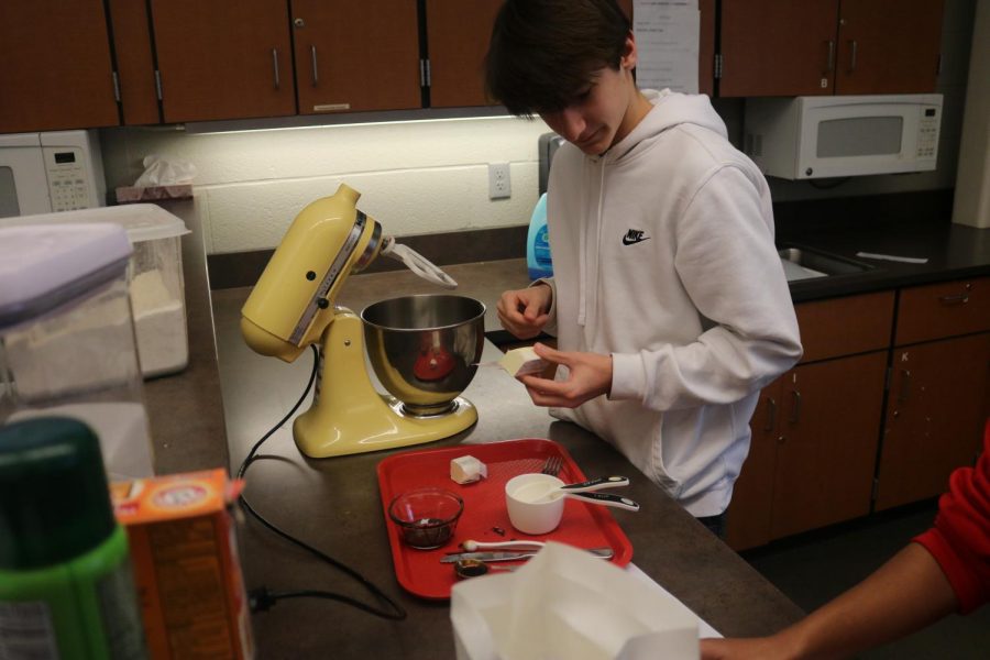 Jackson Webb gets his measuring on so he can start mixing up so fir food. 