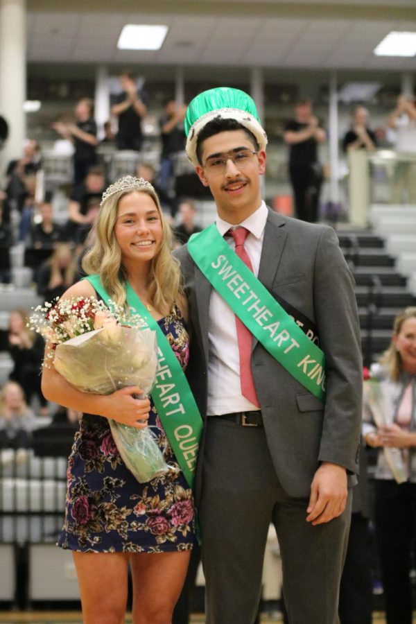Seniors Faris BDair and Emerson Ralston stand together as Sweetheart king and queen.