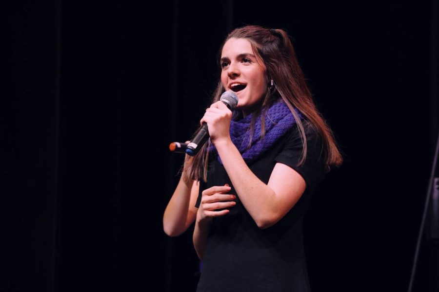 Junior Ashley Hendricks sings alongside KC A Cappella at a recent competition.