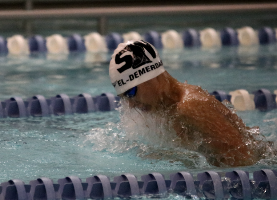Junior Yaseen El-Demerdash swims for the school team at a meet on Jan. 9. 