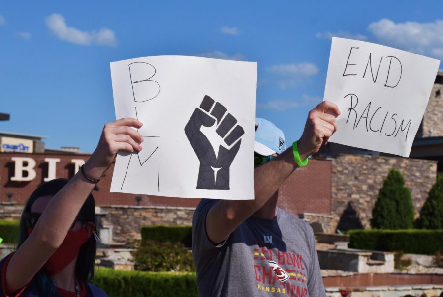 Protesters gather at the 135th and Metcalf intersection on June 12 to show support for the Black Lives Matter movement. 