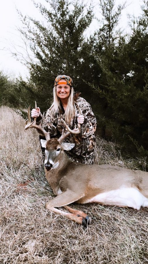 Junior Kendyl Cook poses with her kill after a successful hunt.