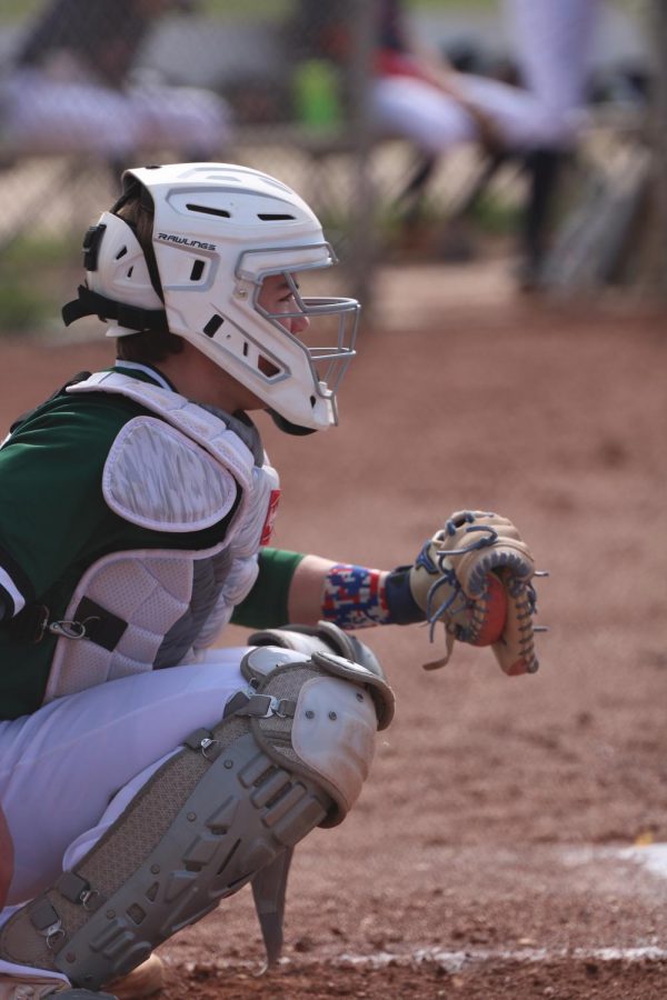 On April 12th, freshman Drew Jakubielski is ready for the pitch as he is warming up in between innings of the BVSW and St. James game. 