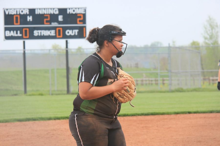 Hand in glove, senior Kayden Williams awaits for the batter to be inside the box.