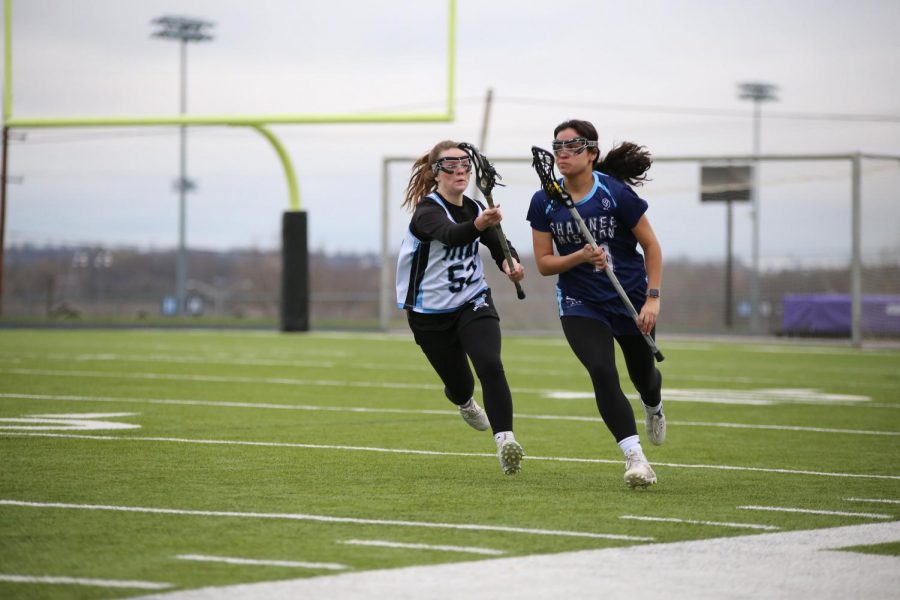 Playing defense, senior Sydney Meschwitz chases her opponent in efforts to steal the ball. 