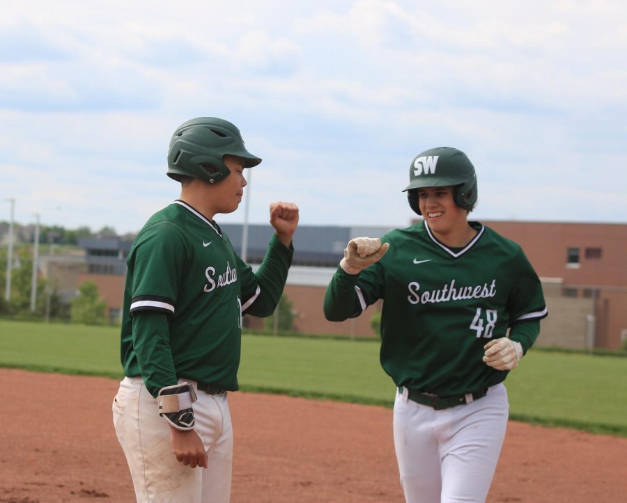 Fists ready to bump, sophomores Kai Barnhart and Jacob Dickey celebrate a good game.