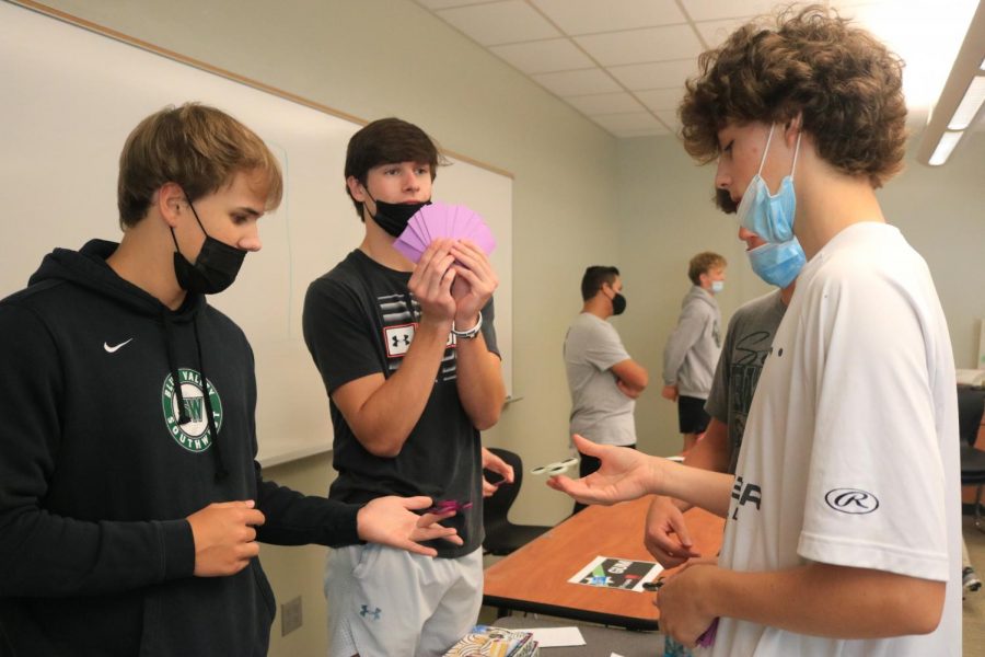 Senior Zach Atkins flaunts his profit during the Marketplace activity in Business Essentials.