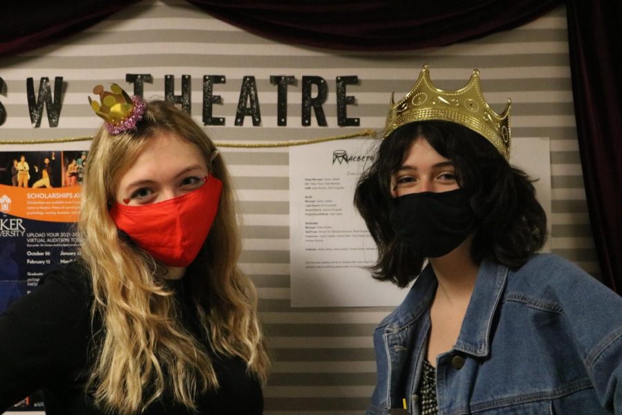 Senior Lauren Kight and Junior Haley Flood pause in the hallway dressed as characters from Alice In Wonderland with the theatre department. 
