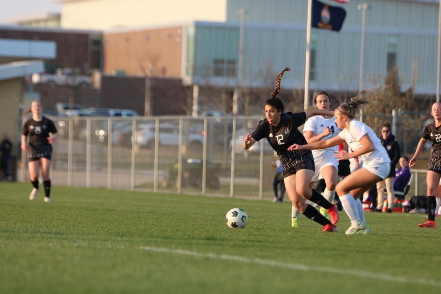 Sophomore Mellek Ibrahim defends the ball from her opponent.