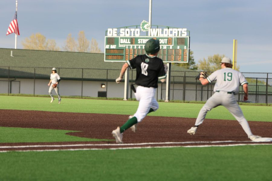 Senior Kuyper Kendall sprints to first base.