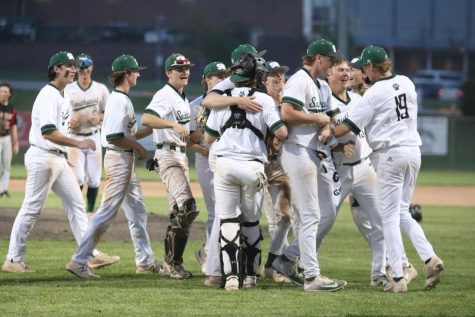 Varsity boys baseball share hugs following a win to become 2022 EKL champions for the first time in school history. 