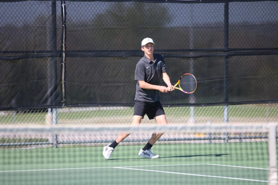  Concentrating on the play, junior Emmitt Wirth participates in the varsity match against Saint Thomas Aquinas on April 17. 
