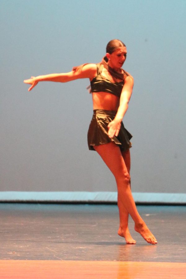 Preparing to turn, senior Caroline Sorcher performs a solo during the showcase on April 7.