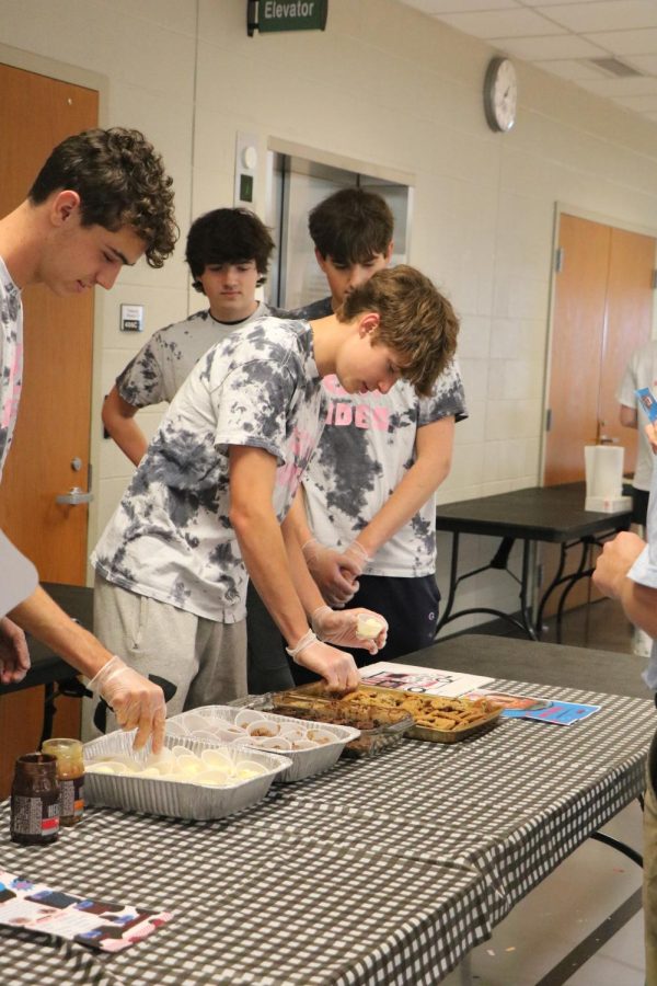 Senior Gavin Wieskamp prepares a custard sample. 