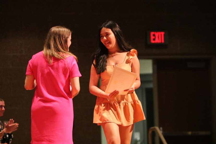 Senior Hai Nguyen smiles as she accepts her NHS scholarship award on May 8. 