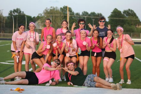 Holding their medals, the senior team “Cougars” pose for a picture after winning the tournament on May 7.