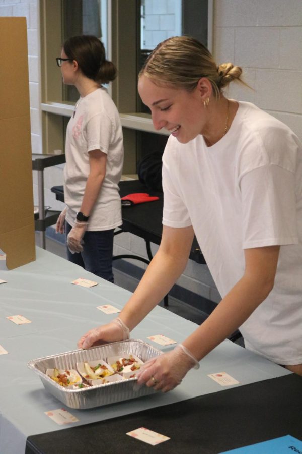 Senior Ella Auman sets out her french fries for her peers to eat. 