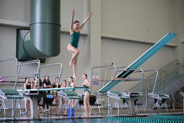 On April 2 senior Alyssa Bonder prepares to dive.