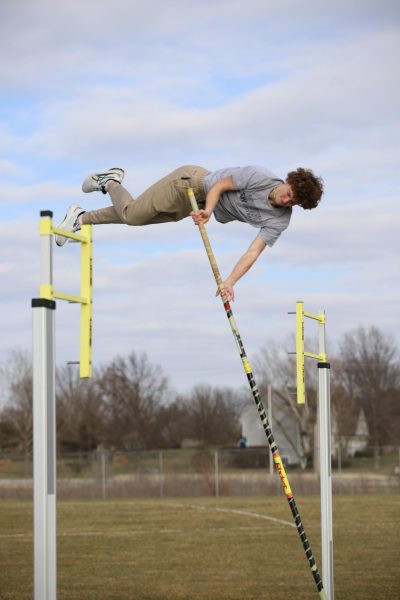 Sophomore Dylan Cross gets height on the pole vault at track practice on March 1. 
